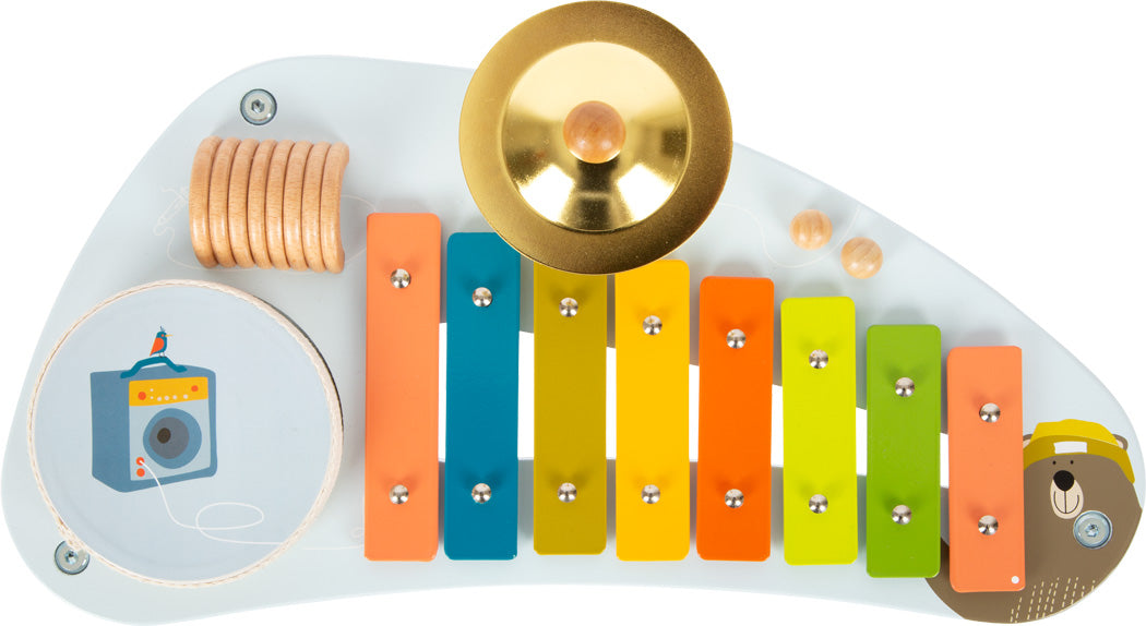 Farbenfroher Kinder-Musiktisch mit Musikspielzeug, Xylophon, Trommel, Becken, Holzringen und Bärenmotiv für spielerische Klang-Erlebnisse.
