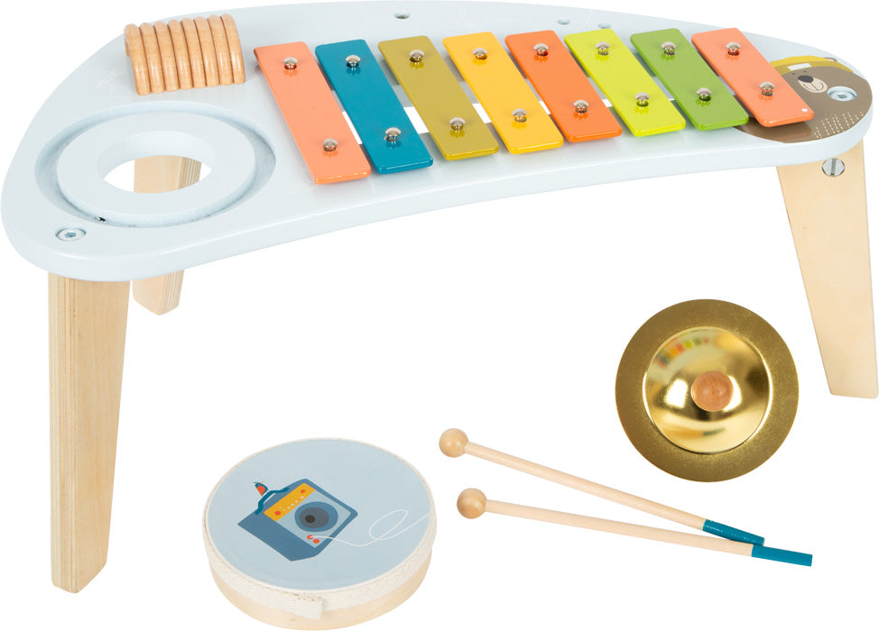 Kinder-Musikinstrumentenset im Musiktisch-Design, bestehend aus Xylophon, Becken, Trommel und zwei Holztrommelstöcken für spielerische Klangerlebnisse.