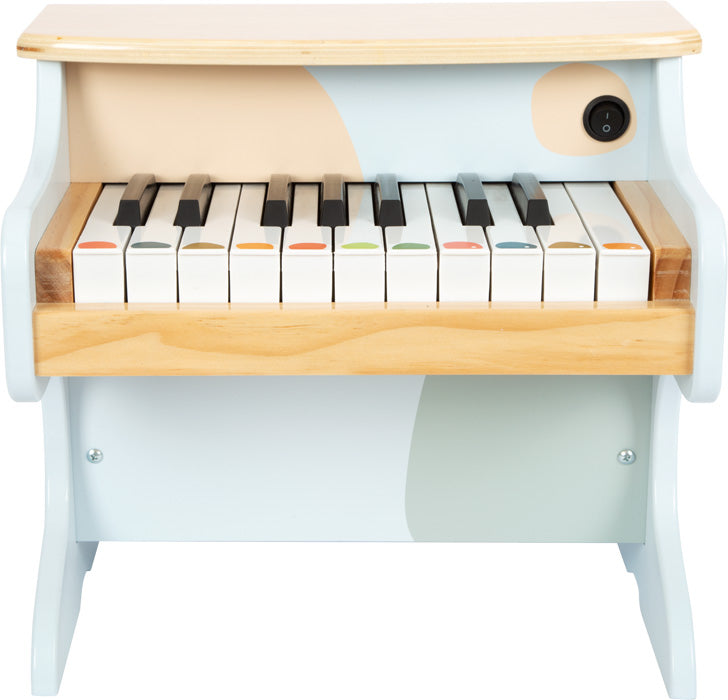 Kleines elektronisches Holzklavier in hellen Pastelltönen mit bunten Punkten auf den Tasten, einem schwarzen Knopf oben rechts – perfekt zur musikalischen Früherziehung und zum Anregen der Kleinen zum Spielen.