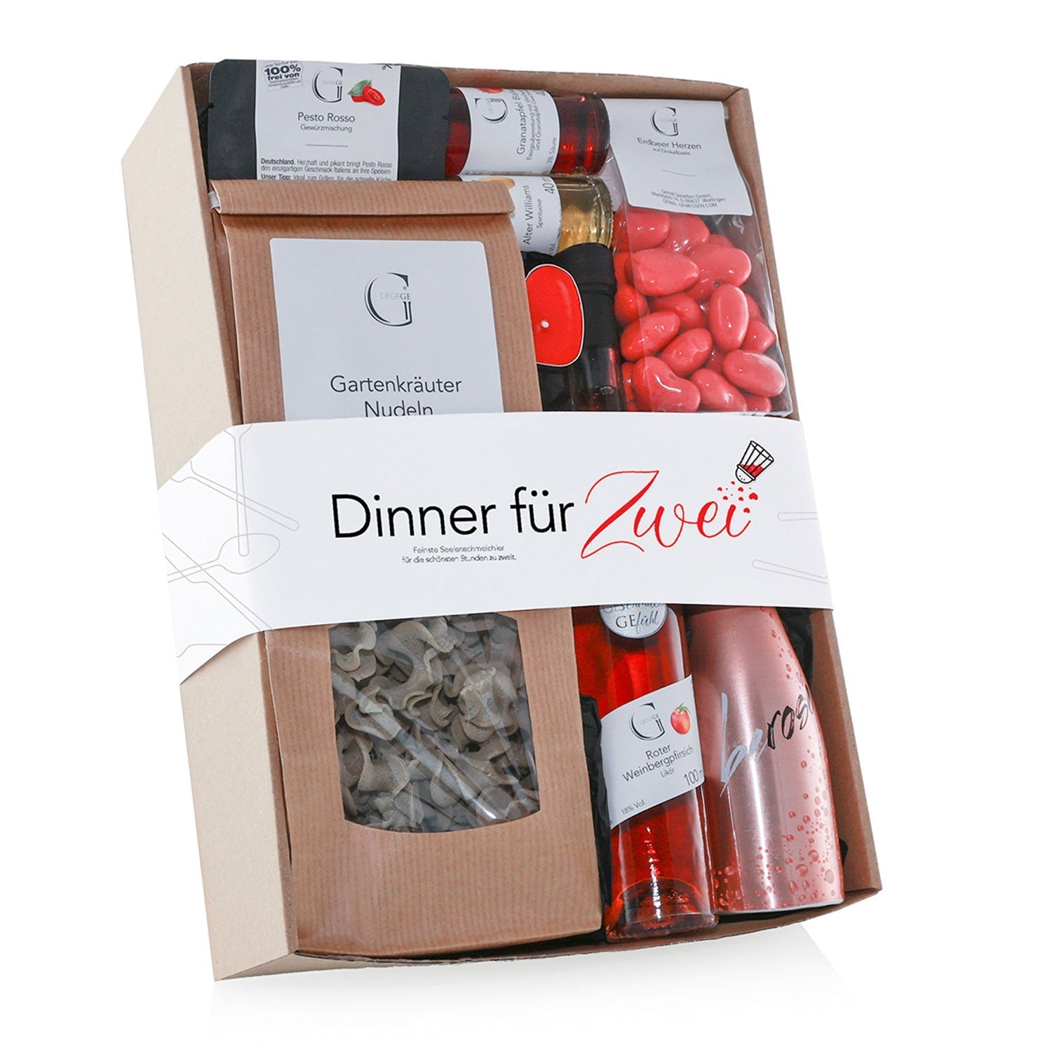 Das Boxset „Dinner für Zwei – Koch-Geschenk“ zaubert einen romantischen Abend mit Pasta, Pesto, roten Herzbonbons, kleinen Weinflaschen und einem prickelnden Getränk, alles elegant verpackt in einer Pappschachtel mit durchsichtigem Kunststoffdeckel – ein perfektes Geschenk für Pärchen.