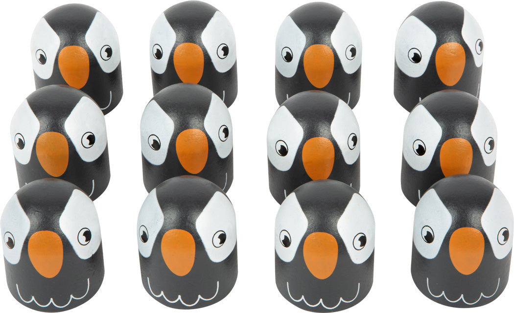 Zwölf pinguinförmige Objekte mit schwarzen, weißen und orangefarbenen Merkmalen ergeben in Reihen angeordnet ein bezauberndes Farben-Memo-Gedächtnisspiel für Freunde und Familie.