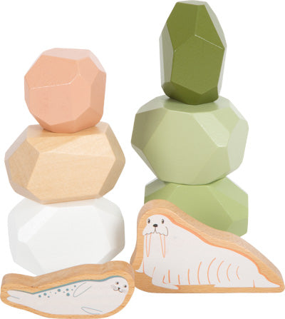 Pastellfarbene Balancierbausteine in arktischem Design mit Holzrobbe und Walross-Figuren vorne – inspiriert von der Montessori-Pädagogik.