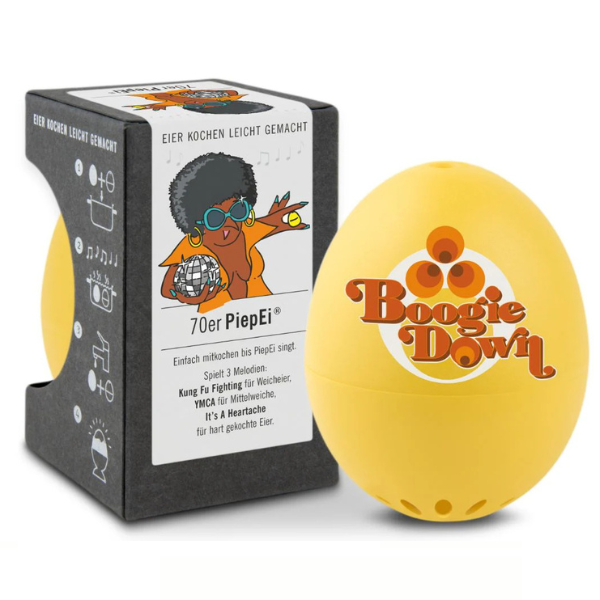 Gelber, eiförmiger Timer mit Boogie Down-Logo, inspiriert von PiepEi, befindet sich neben seiner schwarzen Verpackung im Retro-Stil – ideal für perfekt gekochte Eier in Ihrem bevorzugten Härtegrad.