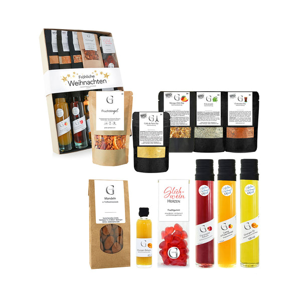 Eine Auswahl an Weihnachtsgeschenksets mit verschiedenen Leckereien und Gewürzmischungen in dekorativen Verpackungen umfasst Flaschen  Beutel und Schachteln.
