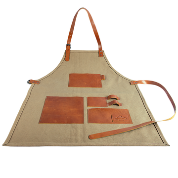 Gartenschürze mit braunen Lederstecktaschen und Riemen, ideal für Hobbygärtner, flach auf Hintergrund präsentiert.