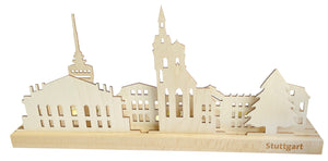 Holzsilhouette der Stuttgarter Wahrzeichen auf einem Ständer aus Echtholz mit der Gravur „Stuttgart“ auf der Vorderseite. Inspiriert von der Kunst des Erzgebirges dient dieses Stück auch als charmanter Teelichthalter für gemütliches Ambiente.
